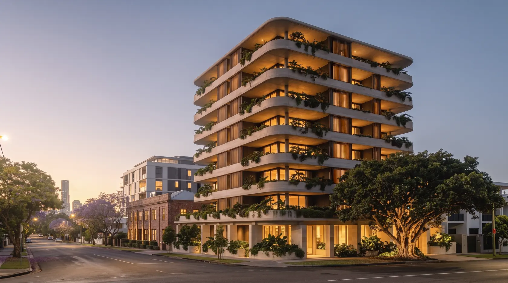 Alder at dusk: the stacked slab terraces glowing from within, planting silhouetted along every edge and the fig uplit beneath a deep blue sky.